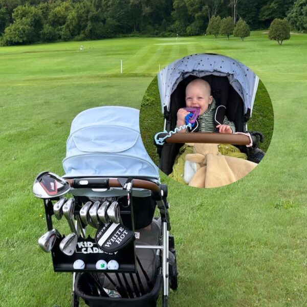 Kid Caddie golfing with a baby